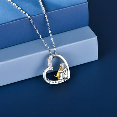 Collana con cuore d'argento con cane e pietre di zirconia